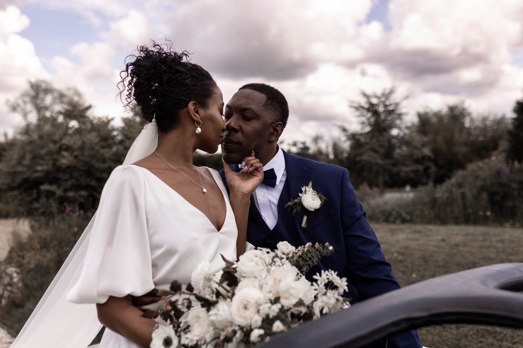 bride wears vegan pearl jewellery at a sustainable wedding at Huntsmill Farm in Buckinghamshire